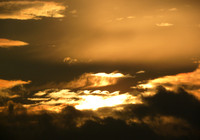 Clouds form a set of waves during an sunset